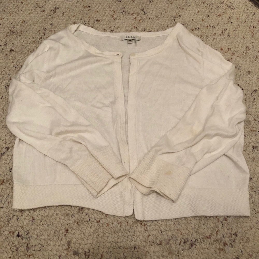 White Tyler Boe cropped sweater.